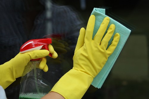 Carpet cleaning team preparing equipment safely before starting a job